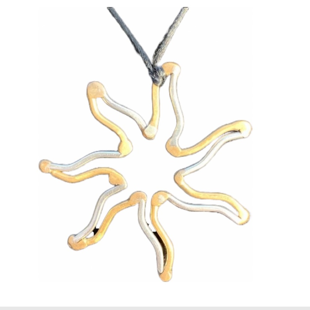 Star pendant. Gold and Silver tone. Nylon cord. Handmade